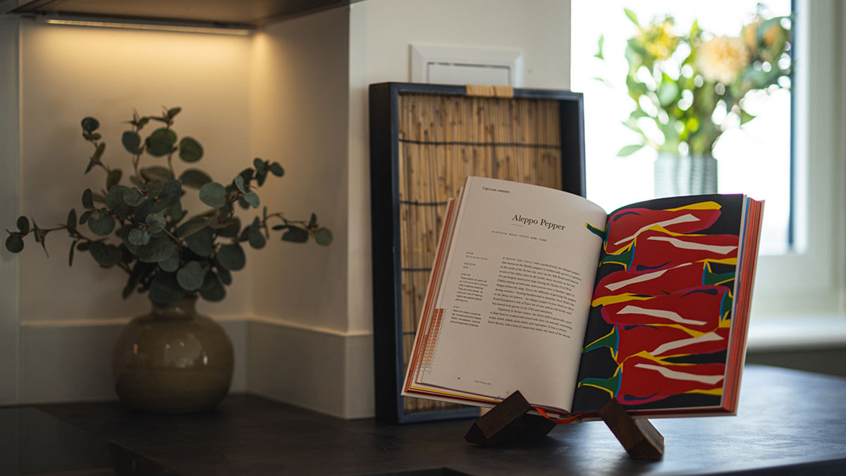 cookbook open to Aleppo Pepper recipe at square roots