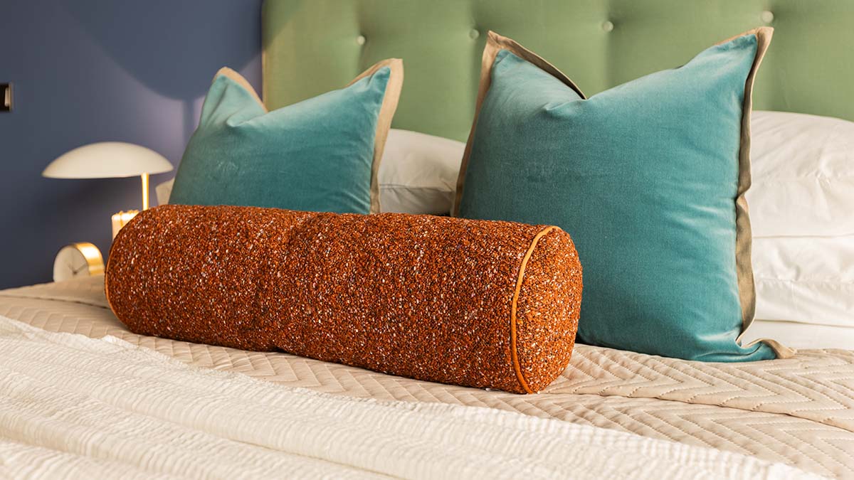 Textured cushions and luxury bedding details, key to a high-yield before and after London flat transformation
