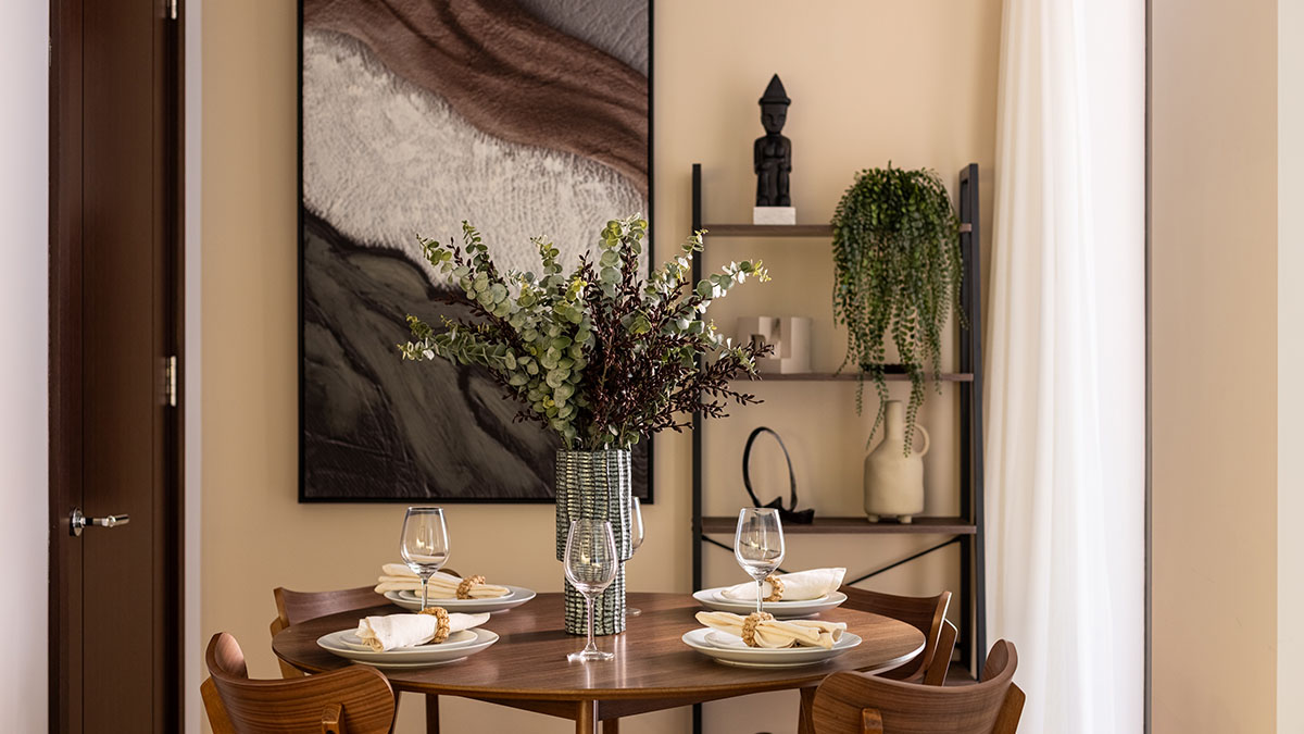 Contemporary dining area with styled table setting in West End Gate furnished apartment